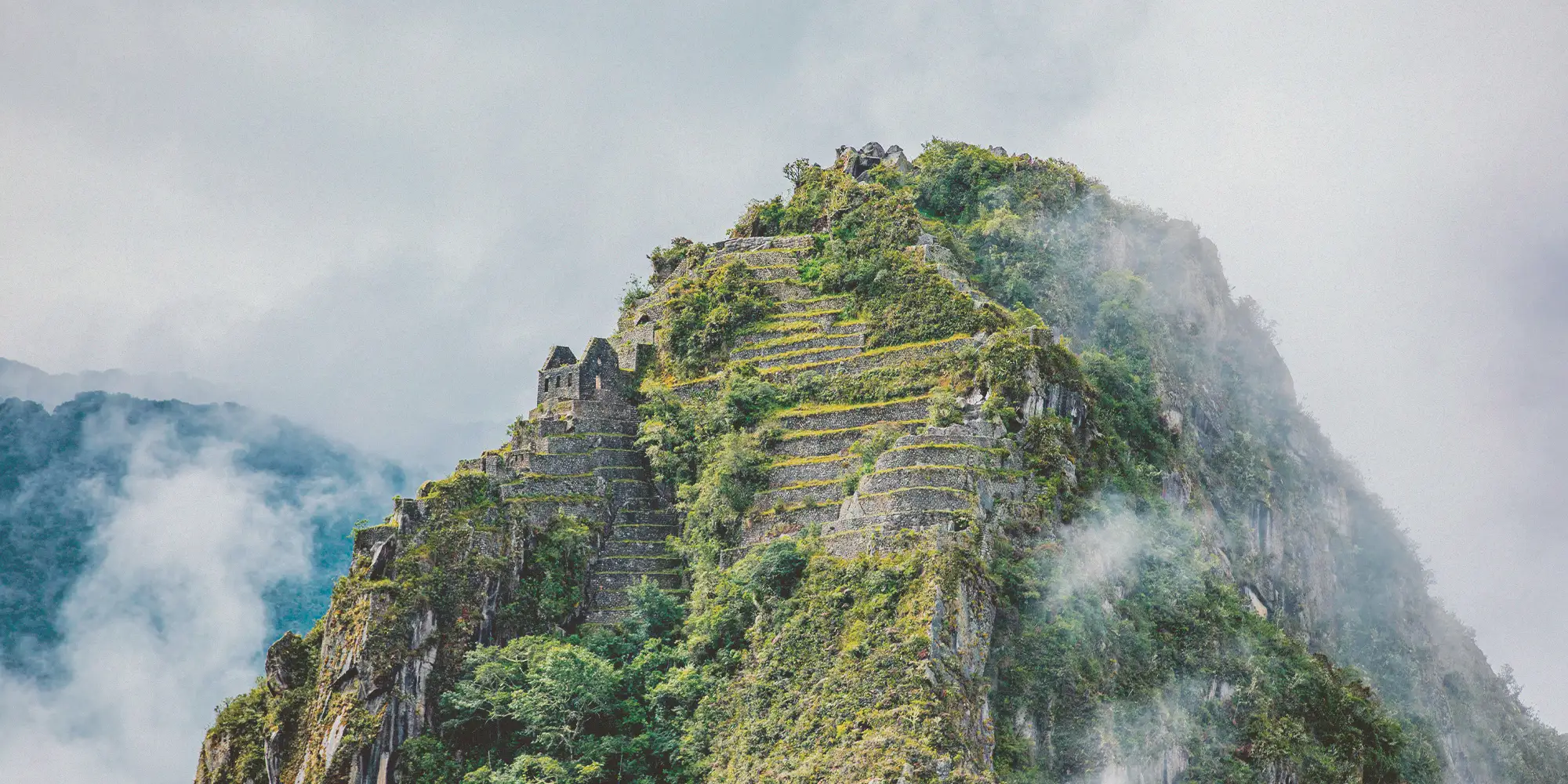 Traveler overlooking Machu Picchu, Peru