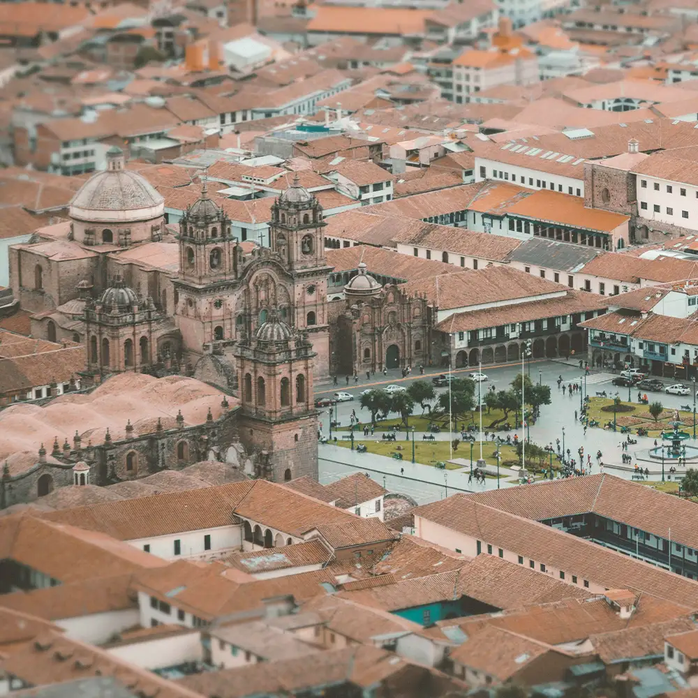 Plaza de Armas with the cathedral and the Andes behind