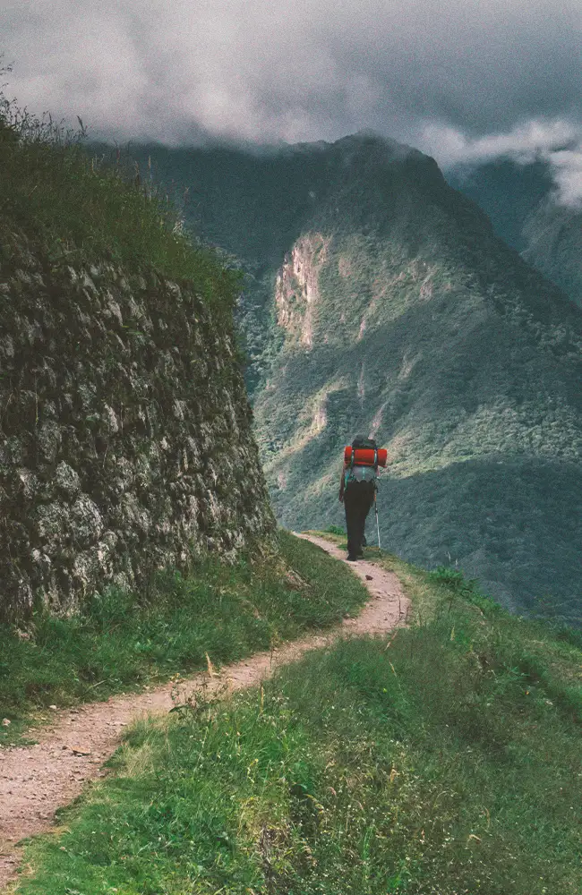 Hikers on a stone-paved stretch of the Inca Trail